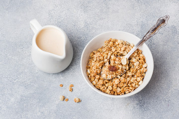 Healthy breakfast. Fresh granola, muesli with yogurt on grey background. Copy space