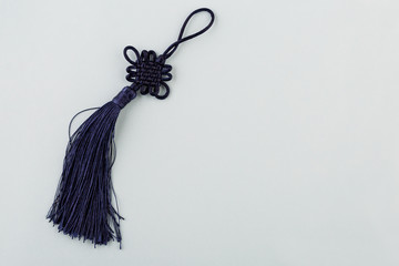 Chinese lucky knot on blue background, Copy space