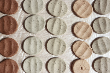 clay samplers dry. Spanish stone masses in the form of round pellets for testing glazes