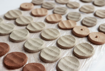Obraz na płótnie Canvas clay samplers dry. Spanish stone masses in the form of round pellets for testing glazes