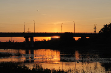 Sunset on the river. The famous bridge against a beautiful sky. Picture for wallpaper