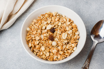 Healthy breakfast. Fresh granola, muesli with yogurt on grey background. Copy space