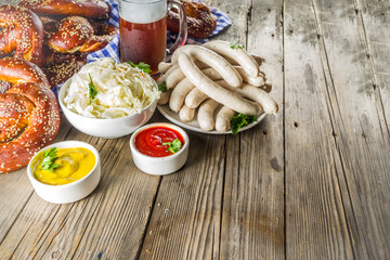 Bavarian German holiday traditions. Oktoberfest food and beer glass mug. Background for congratulations with Oktoberfest, autumn restaurant menu.