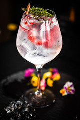 tonic gin with  fresh raspberry and rosemarie plant