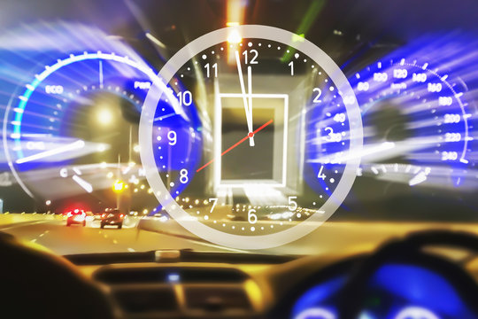 Blurry image of speedometer with clock show midnight time and doze off drive moving very fast speed car at night on super highway.
