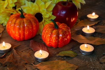 Obraz na płótnie Canvas Happy Thanksgiving concept. Closeup of pumpkin, candle light and apple
