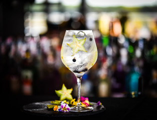 tonic gin cocktail with fresh carambola fruit