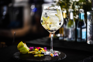 tonic gin cocktail with fresh carambola fruit