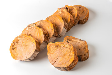 Cross sections of a tree trunk for design. Preparation of elements for decoration.