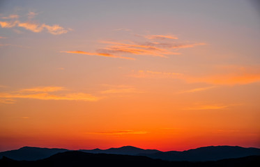 Landscape, sunset in the sky against the mountains, mountain ranges during sunset