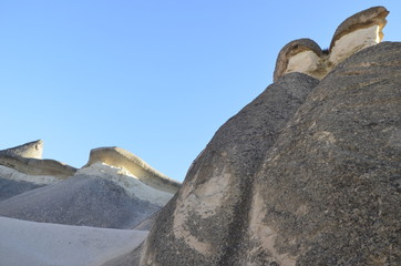 Beautiful fungous forms of sandstone in the canyon. Magic Cappadocia, near Cavusin village, Nevsehir Province in the Central Anatolia Region of Turkey, Asia. Beauty of nature. Concept background