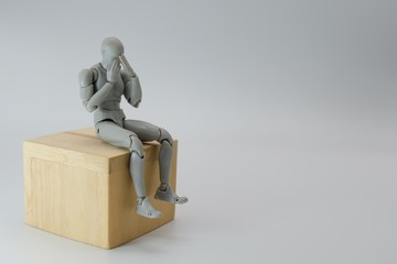 robot sitting on a box