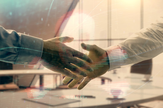 Double exposure of hacking theme hologram on office background with two men handshake. Concept of data security