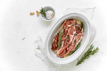 Marinated lamb chops with garlic and rosemary, top down view