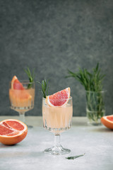 Grapefruit and rosemary alcohol drink, front view
