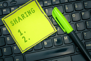 Handwriting text Sharing. Concept meaning have portion of something with another or others give...