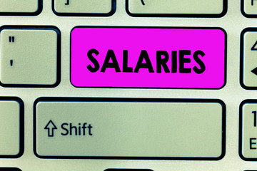 Handwriting text Salaries. Concept meaning fixed regular payment typically paid on monthly basis...