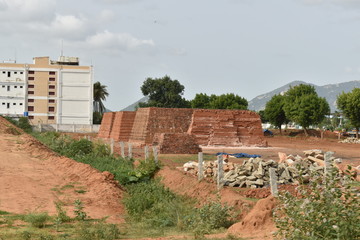 PREPARED AND STOCKED RED BRICKS IN THE GROUND