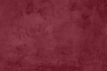 Dark red Concrete textured background to your concept or product. Winter 2020 color trend.