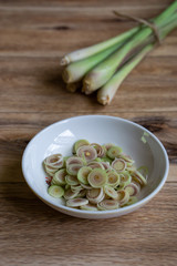 Fresh lemongrass isolated on wooden background. Selective focus.