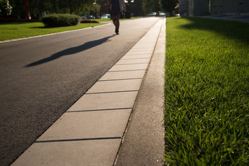 Sidewalk and human shadow