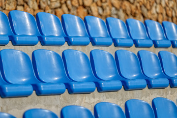 Fototapeta premium Blue Chairs At The Stadium