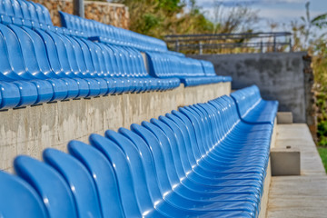 Fototapeta premium Blue Chairs At The Stadium