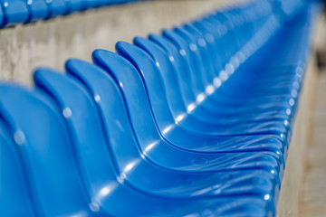 Fototapeta premium Blue Chairs At The Stadium