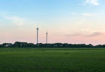 Fototapeta na wymiar Windkraft zwei windkrafträder auf dem land in Brandenburg deutschland nachhaltigkeit energiewende