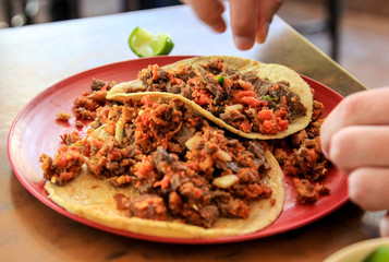 mexican food taco campechano with meat and lime 