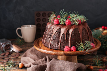 Tasty Christmas pie on wooden table