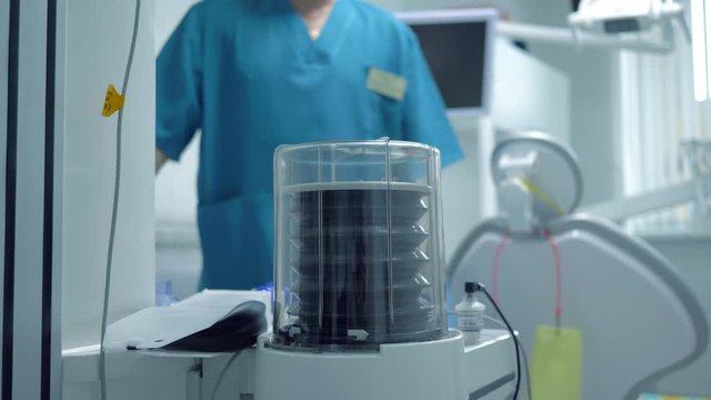preparation for surgery, the doctor examines modern medical instruments for supplying oxygen to patients during treatment of the oral cavity and teeth under anesthesia