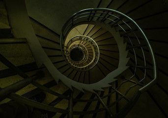 The spiral staircase detail in a beautiful of the building.