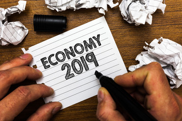 Text sign showing Economy 2019. Conceptual photo State of wealth and resources of a country in...