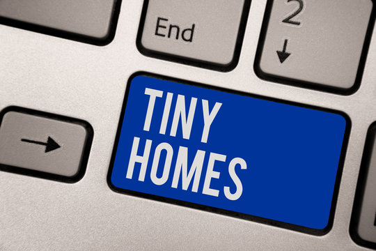 Writing note showing Tiny Homes. Business photo showcasing houses contain one room only or two and small entrance Cheap Keyboard blue key Intention computer computing reflection document