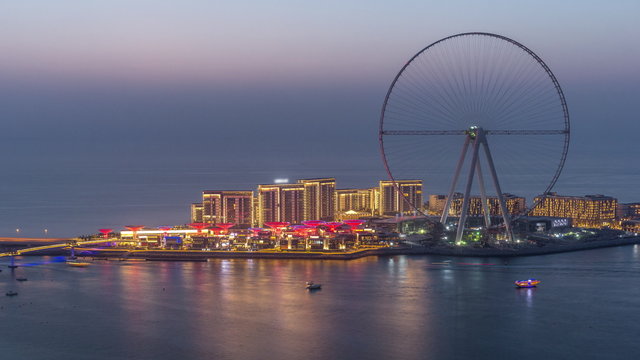 Bluewaters Island in Dubai aerial day to night timelapse after sunset.
