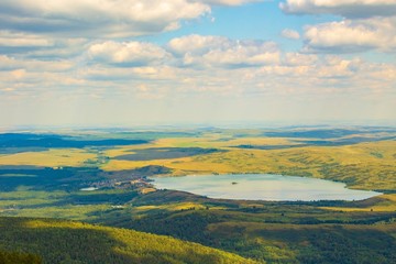View of lake Beloe. Nature of mountain Sinyukha, the highest mountain Kolyvan ridge. Altai Krai, Russia.