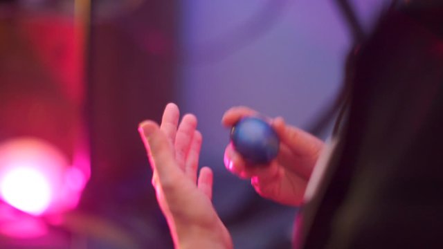 close up of playing a musical instrument shaker