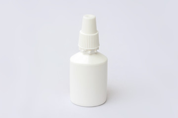 Nasal spray bottle, close up, white background, copy space