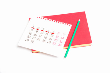 Calendar, pencil and notebook, chart menstrual cycle, white background, copy space
