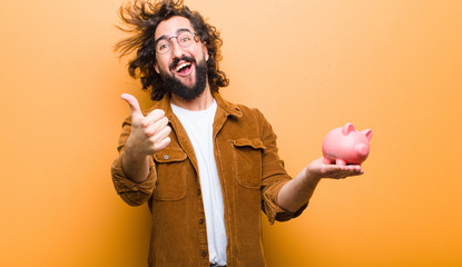 young man with crazy hair in motion and a piggy bank