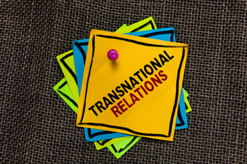 Text sign showing Transnational Relations. Conceptual photo International Global Politics Relationship Diplomacy Black bordered different color sticky note stick together with pin on jute sack