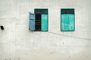Fototapeta premium Old two green windows and wall background photo
