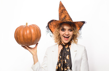 Preparation Halloween holidays. Woman witch with pumpkin. Halloween party. Happy Halloween. Emotional woman in witch halloween costume with jack o lantern. Sensual girl in witch hat with pumpkin.
