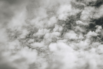 White clouds in the dark sky, thunderstorm. monochrome.