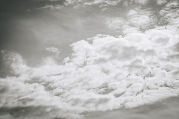 White clouds in the dark sky, thunderstorm. monochrome.