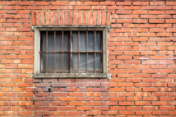 old window on red brick wall