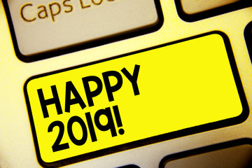 Text sign showing Happy 2019. Conceptual photo time or day at which a new calendar year begin from now Keyboard yellow key Intention create computer computing reflection document