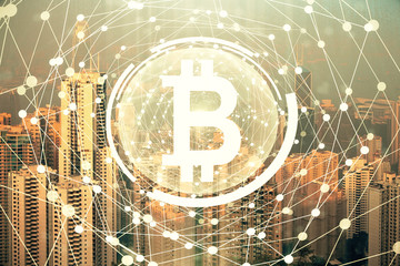 Double exposure of crypto currency theme hologram drawing and city veiw background. Concept of...