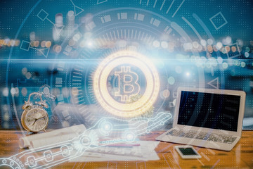 Double exposure of blockchain and crypto economy theme hologram and table with computer background....